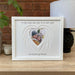 Heart Angel Wing mount in a white frame on tabletop