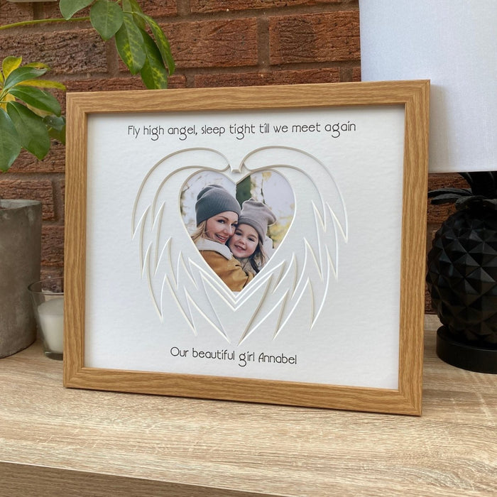 Heart Angel Wing mount in a beige frame on tabletop